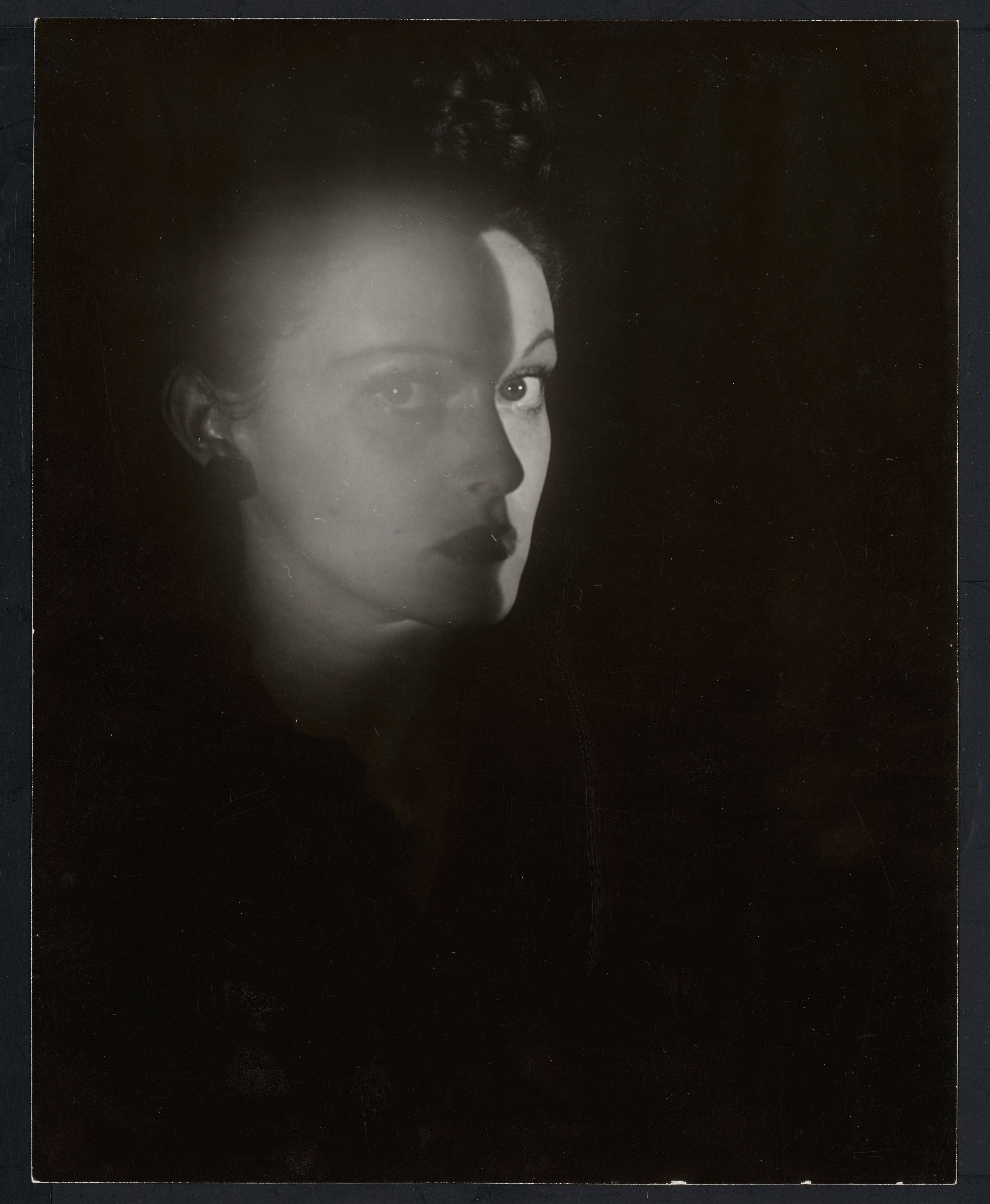 This picture shows the following artwork: Erwin Blumenfeld. Portrait of a Woman, New York. 1943.