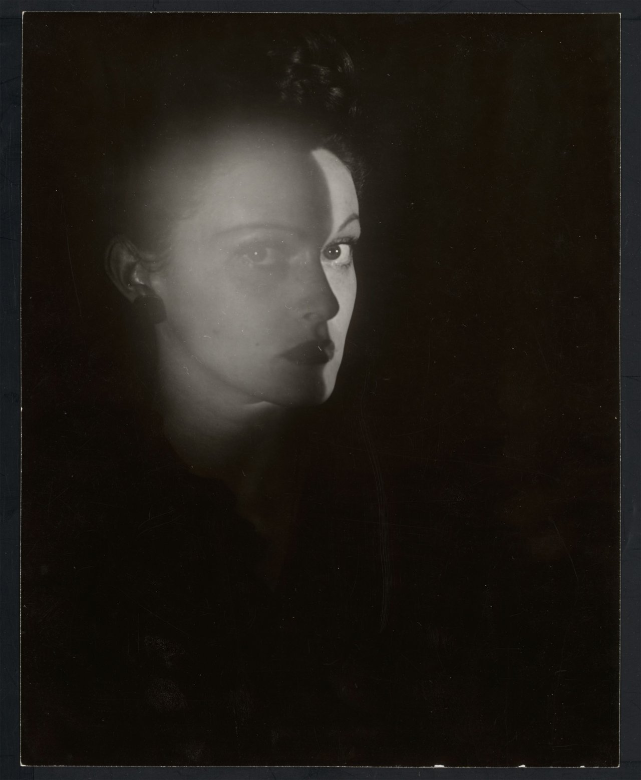 This picture shows the following artwork: Erwin Blumenfeld. Portrait of a Woman, New York. 1943.