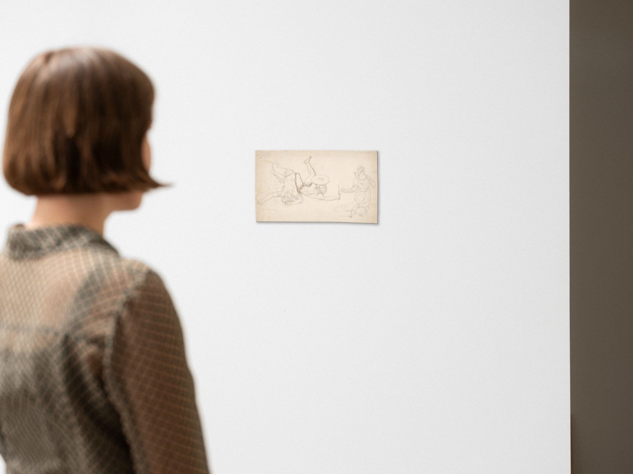 Auf diesem Bild ist das folgende Kunstwerk zu sehen: Peter von Cornelius. Zwei gestürzte Krieger, kniende Frau. 1831.